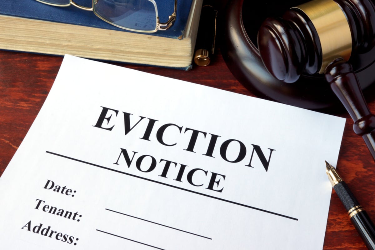 Eviction notice and gavel on a table