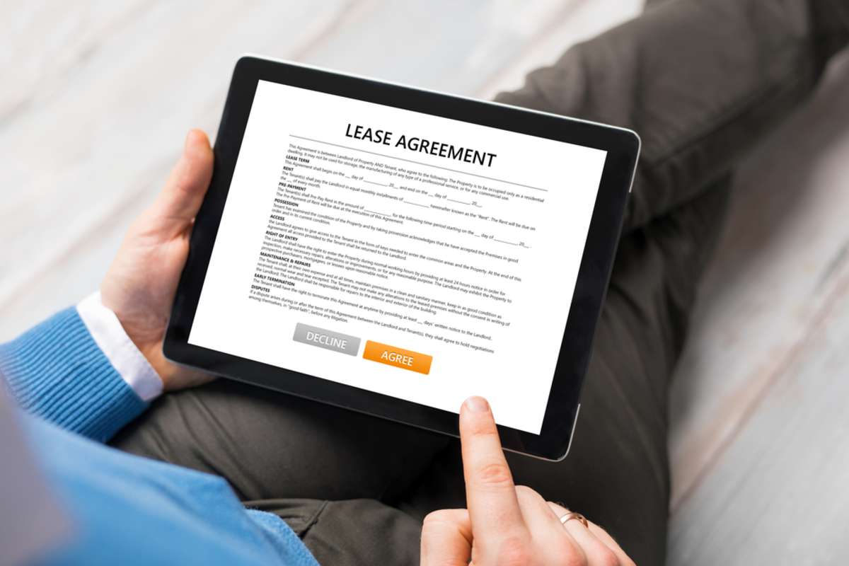 Man reading lease agreement