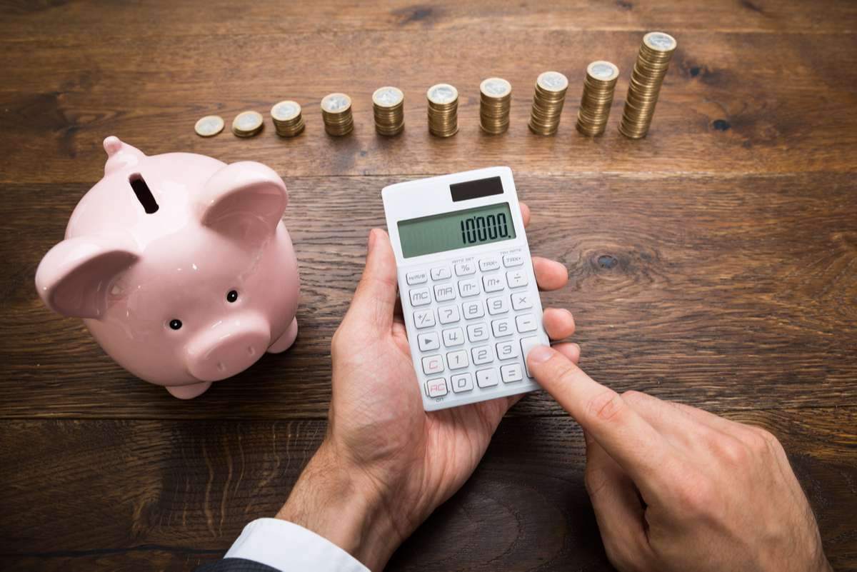 Businessman With Coins And Piggybank (R) (S)