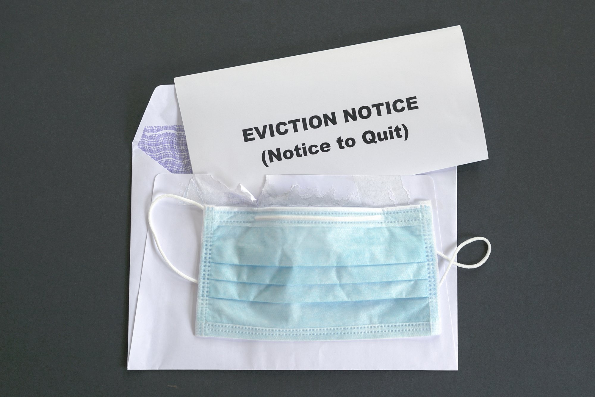 Eviction notice with face mask. Top view