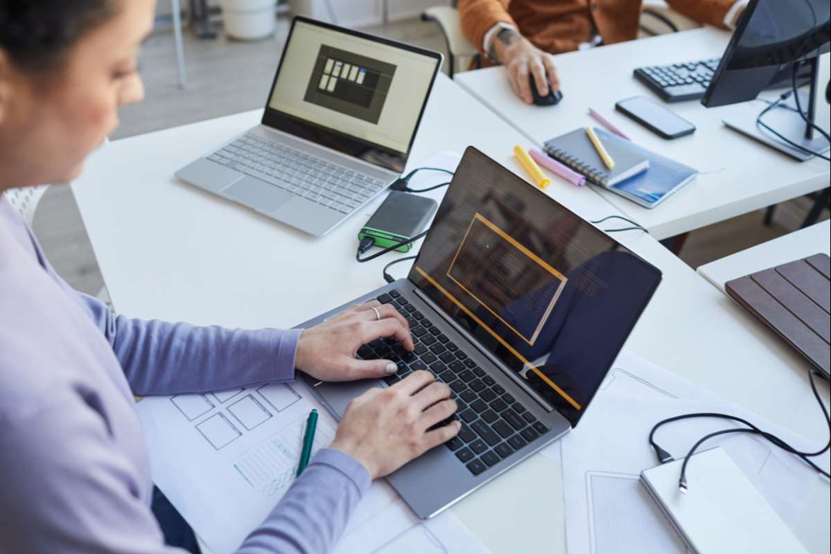 Female IT Programmer Using Laptop (R) (S)