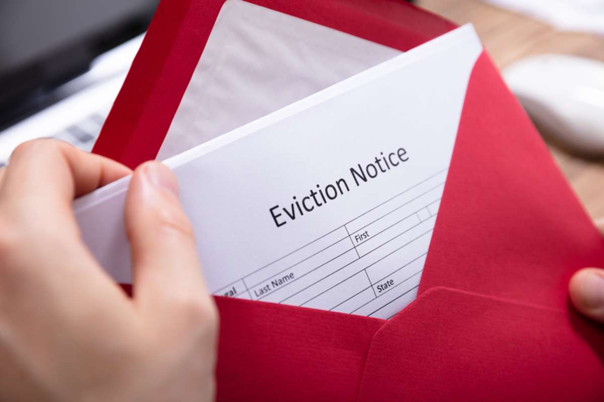 Hand Holding Eviction Notice