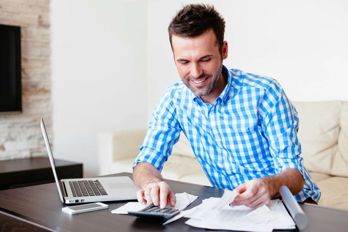 Man analyzing his expenses (R) (S)