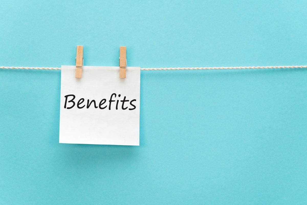 Piece of paper on clothespins that says benefits