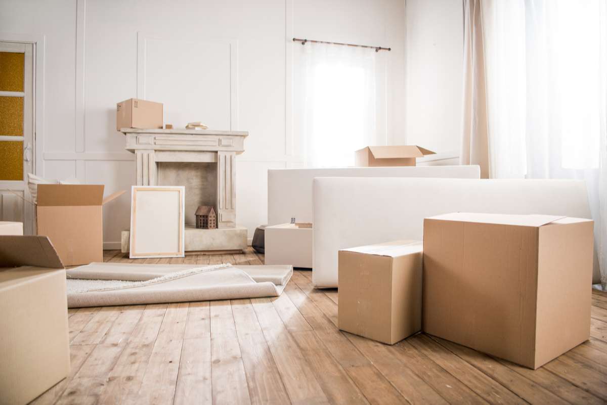 Cardboard boxes in empty room