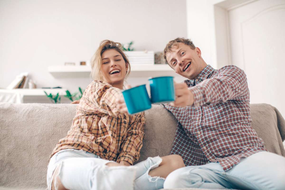 Cheerful young couple in the morning at home