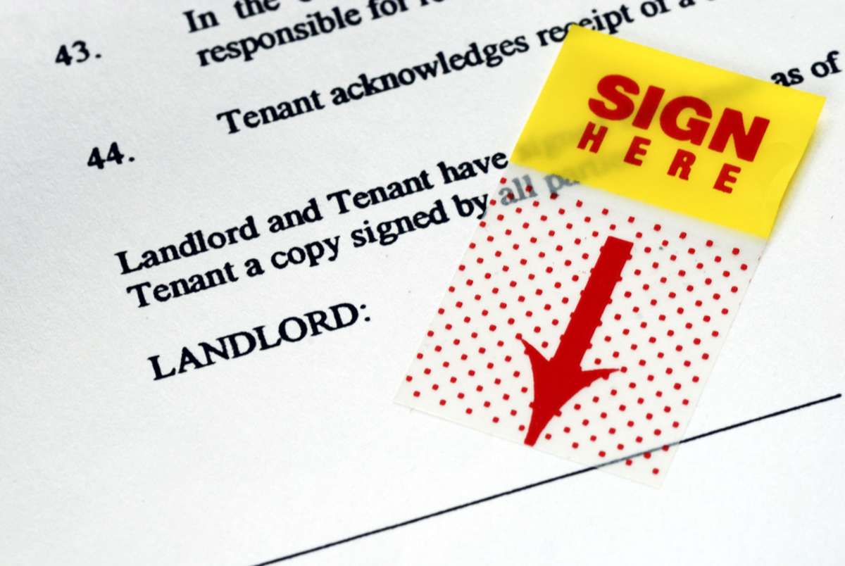 The sign-here sticker on the rental contract