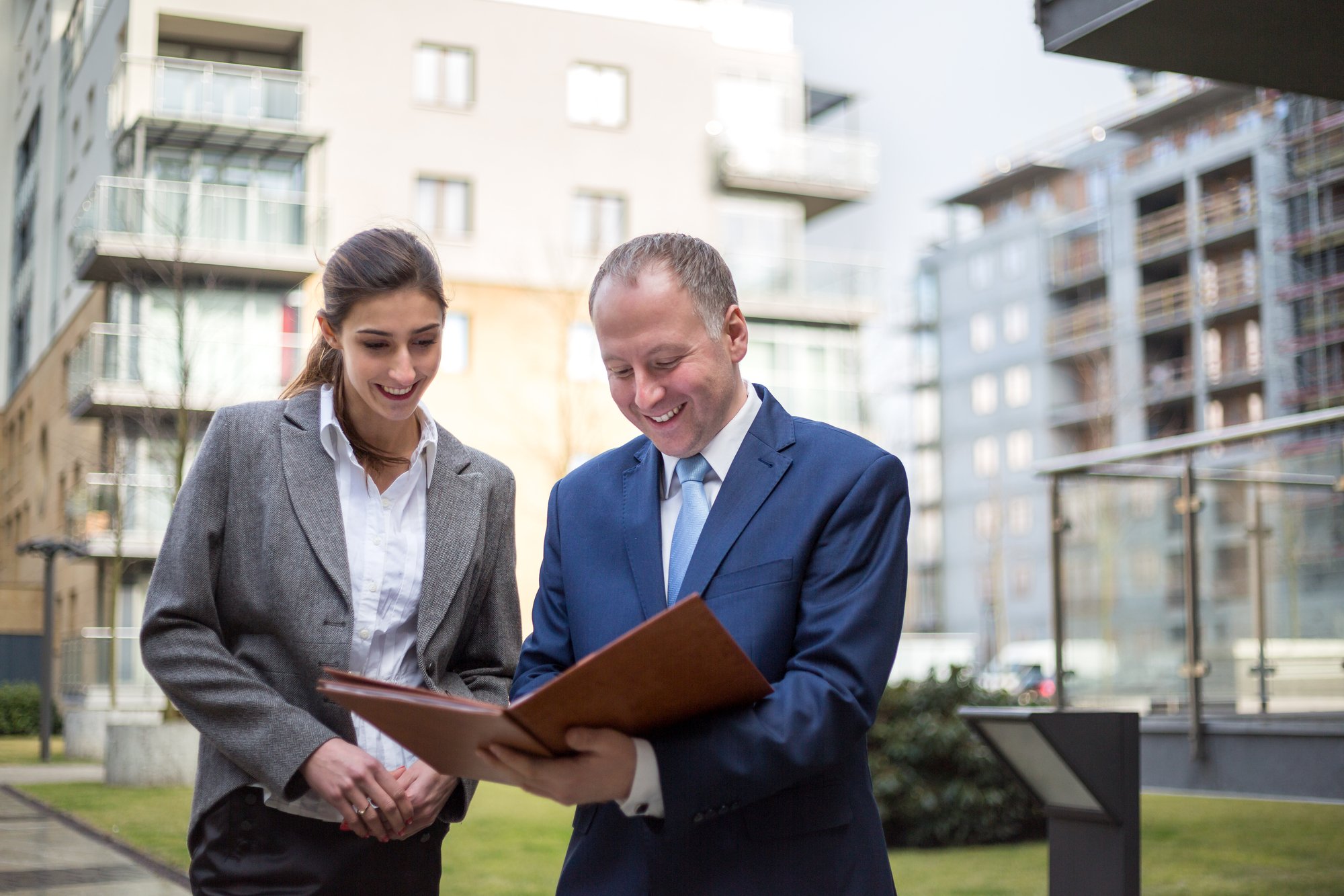 Two business people discussing outside the office