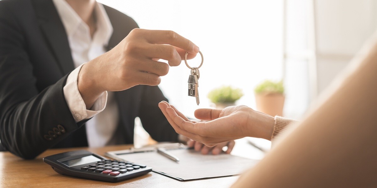 A landlord handing keys to someone