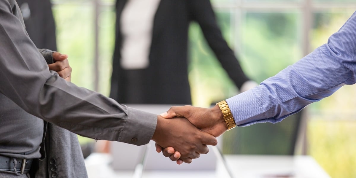 Professionals shaking hands in an office setting